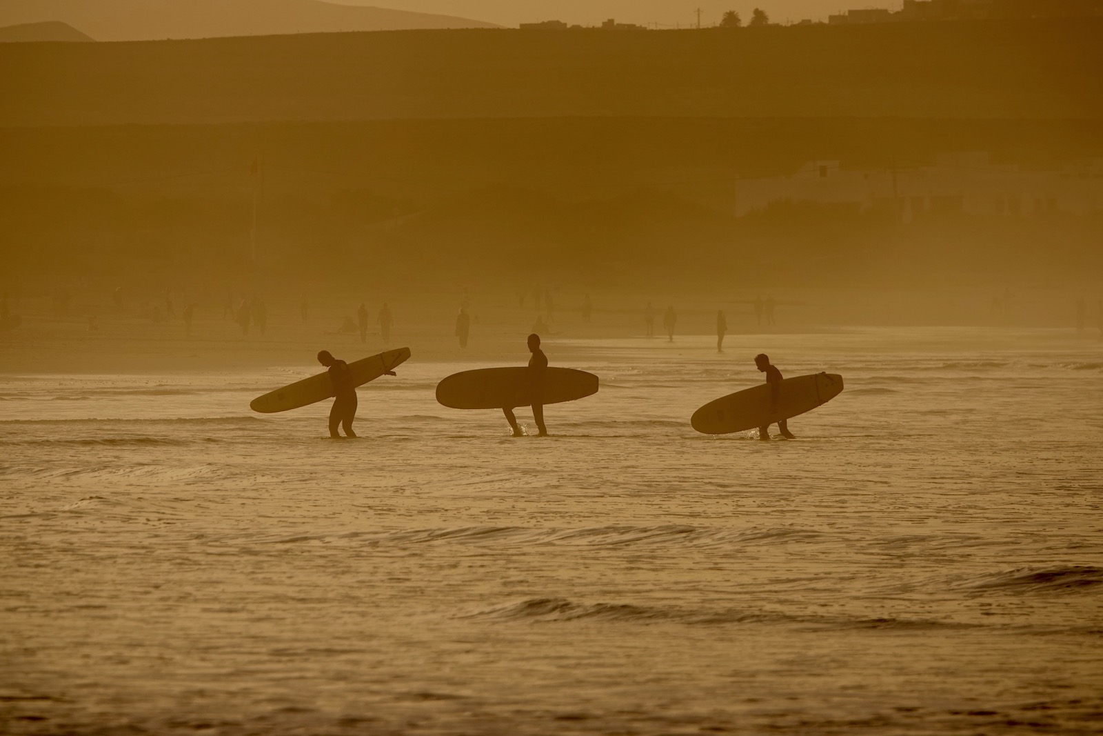 sunset Famara surfers